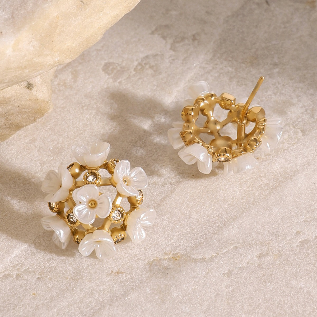 Elegant flower-shaped earrings with gemstone sparkle and 18K gold finish