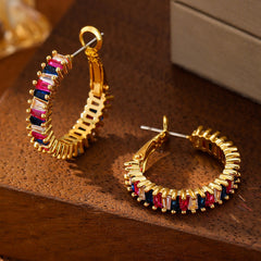 O-shaped 18K gold earrings styled with light luxury outfit