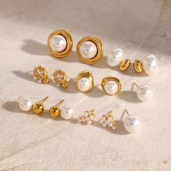 Multiple geometric gold earrings inlaid with pearl – artistic designs
