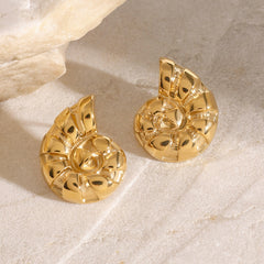 Elegant ocean-inspired gold earrings styled for summer look