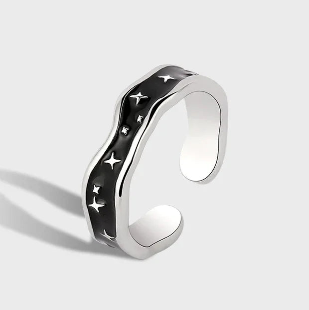 Platinum-plated open ring with wave line design and star accent