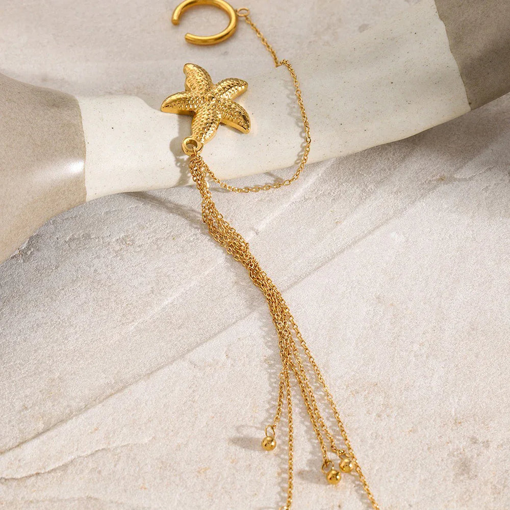 Side view of golden tassel earrings showing movement and layered detail
