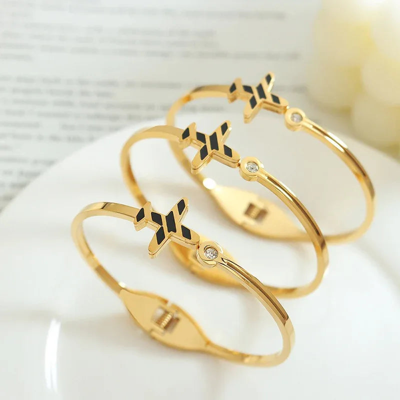 Skyline Spirit gold bracelet displayed on neutral fabric in soft lighting