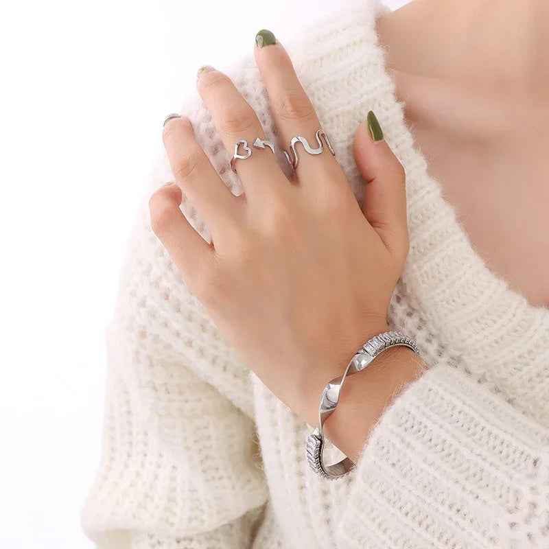 Twist Radiance - 18K Gold Twisted Gemstone Bracelet with Inlaid Design