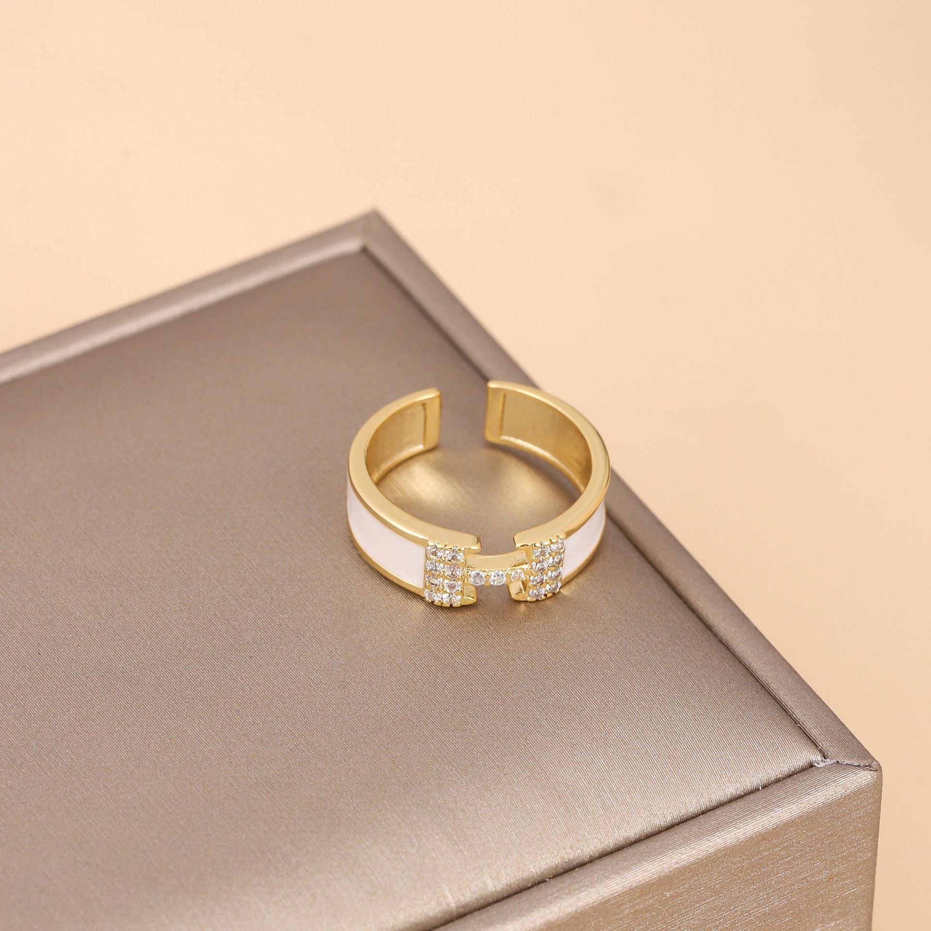 Side profile showing open ring structure and polished geometric design