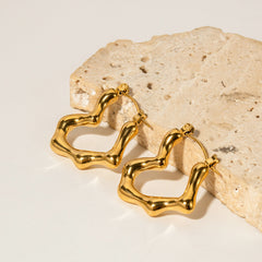 Side profile of bamboo heart earrings showing delicate gold texture