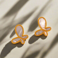 Butterfly-shaped 18K gold earrings featuring brilliant-cut gemstones