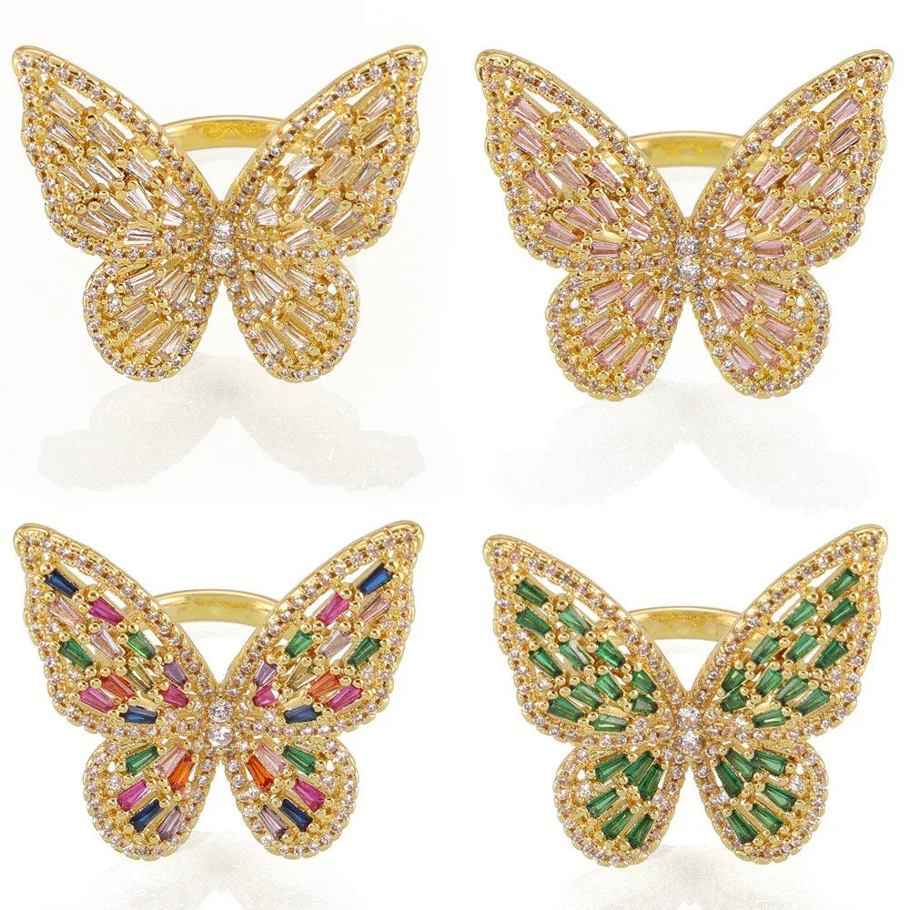 Butterfly zircon ring displayed on soft neutral background under soft light