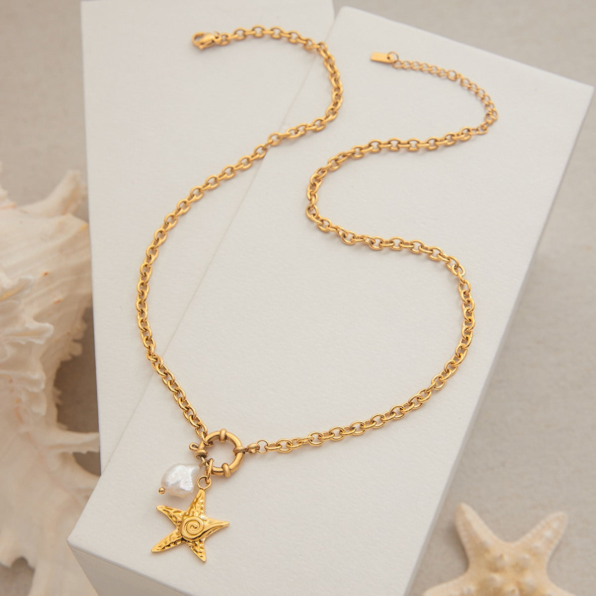 Ocean-inspired layered gold necklace set with pearls