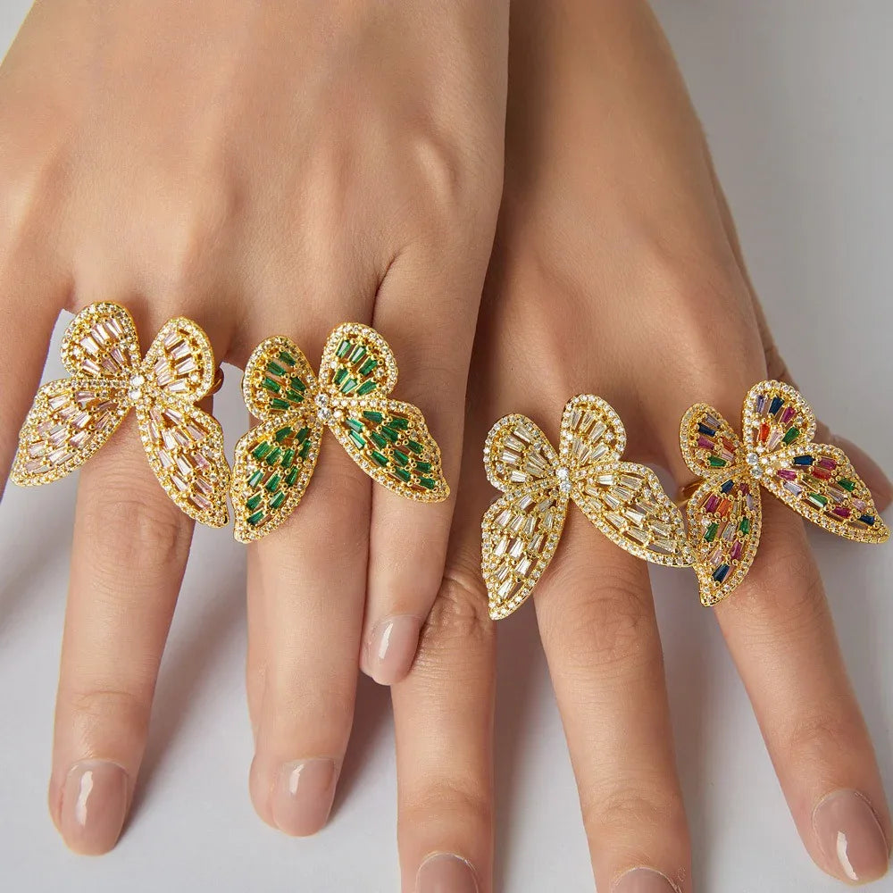 Close-up of butterfly motif with precision-cut zircon accents on gold ring