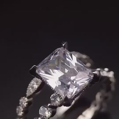 Close-up of moissanite diamonds arranged around luxury silver ring